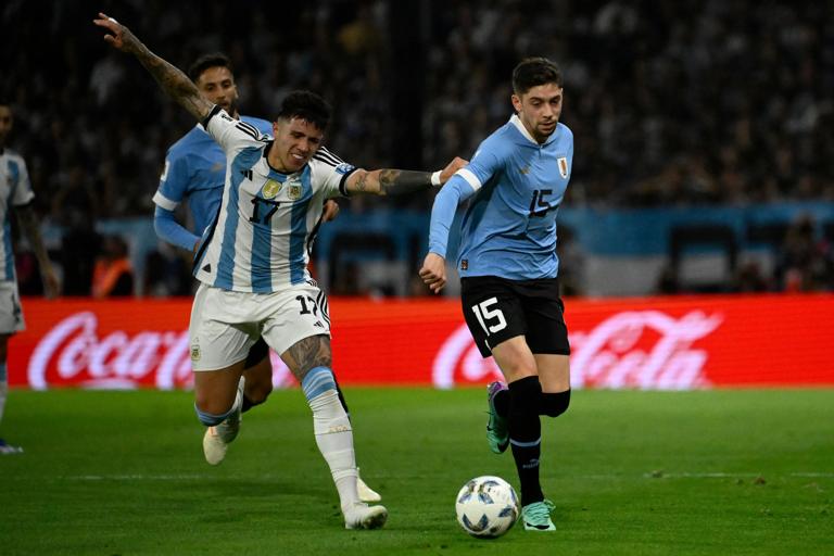 Argentina's midfielder Enzo Fernandez (L) and Uruguay's midfielder Federico Valverde (R) fight for the ball during the 2026 FIFA World Cup South American qualification football match between Argentina and Uruguay at La Bombonera stadium in Buenos Aires on November 16, 2023. (Photo by Luis ROBAYO / AFP) (Photo by LUIS ROBAYO/AFP via Getty Images)