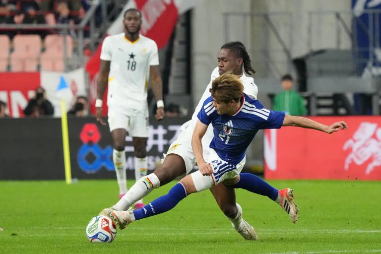 Kaishu Sano of Japan (R) compete for the ball during the international friendly match between Japan and Ghana at Toyota Stadium on November 14, 2025 in Toyota, Aichi, Japan.