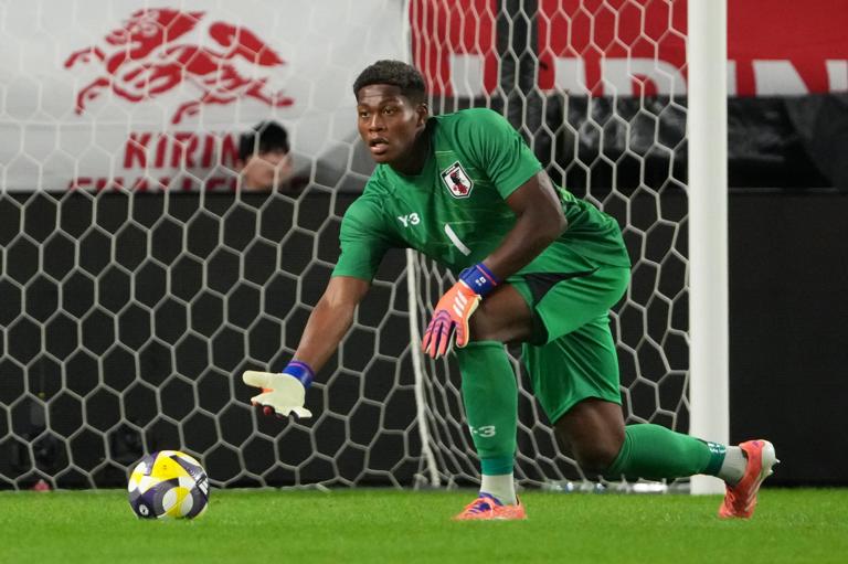 Zion Suzuki in action for Japan in an international match against Paraguay